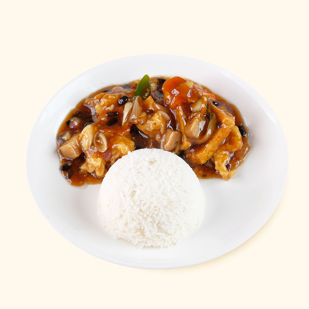 A plate of Taosi Fish Fillet Rice, with the rice topped with a brown sauce and pieces of cooked fish.